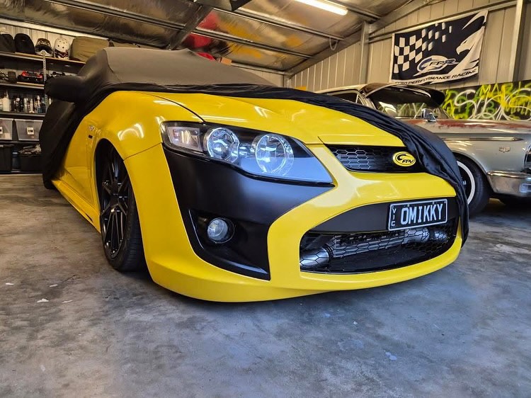 Black cover on a yellow FPV ute